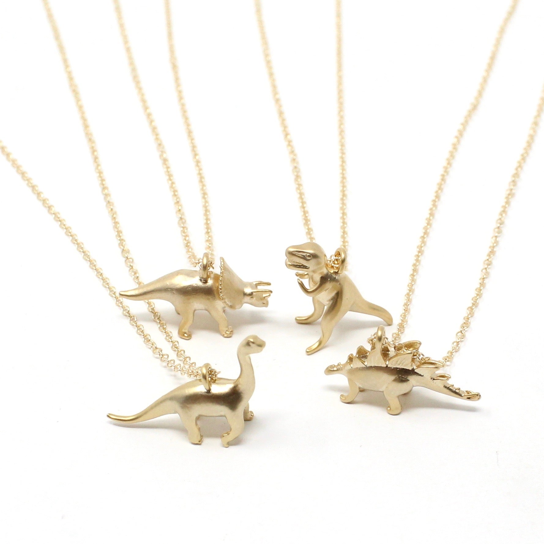 Gold T-rex Pendant - quirky dinosaur jewellery for adults – Ravetta  Jewellery
